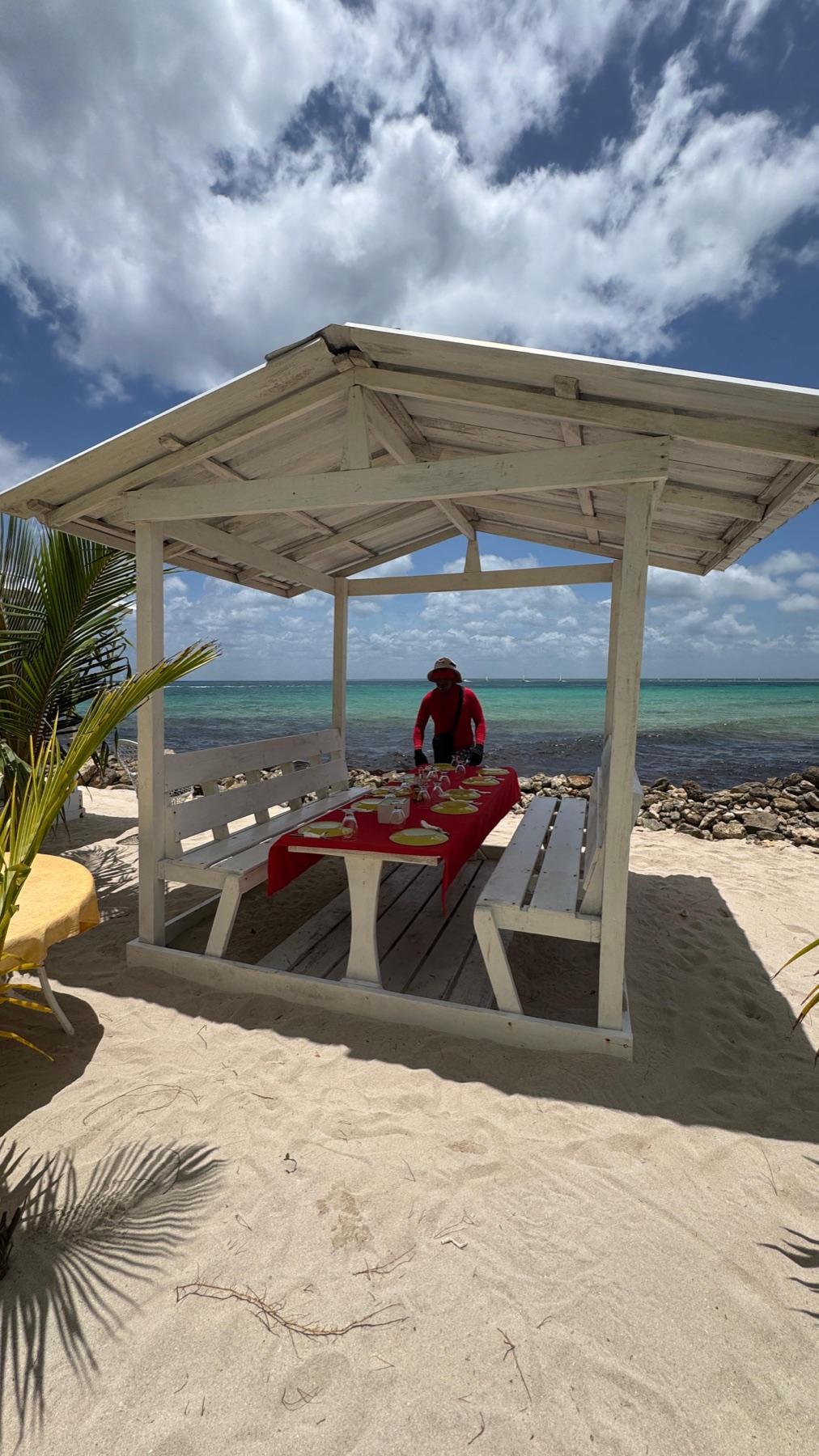 A shaded island lunch table beside the sea